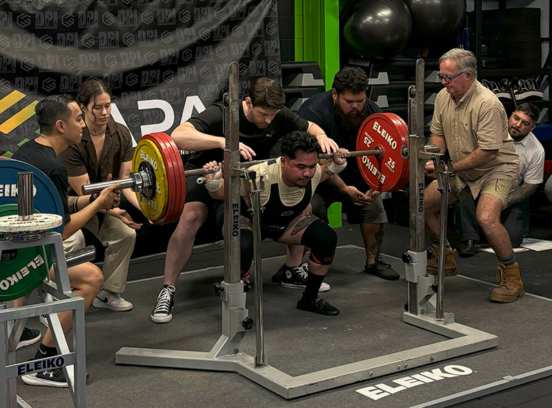 Man at a Powerlifting Competition in Darwin Performing a Squat